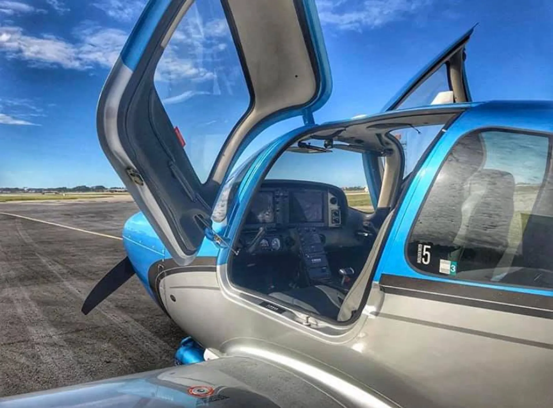 Photograph of a Universal Flight Training plane on the runway