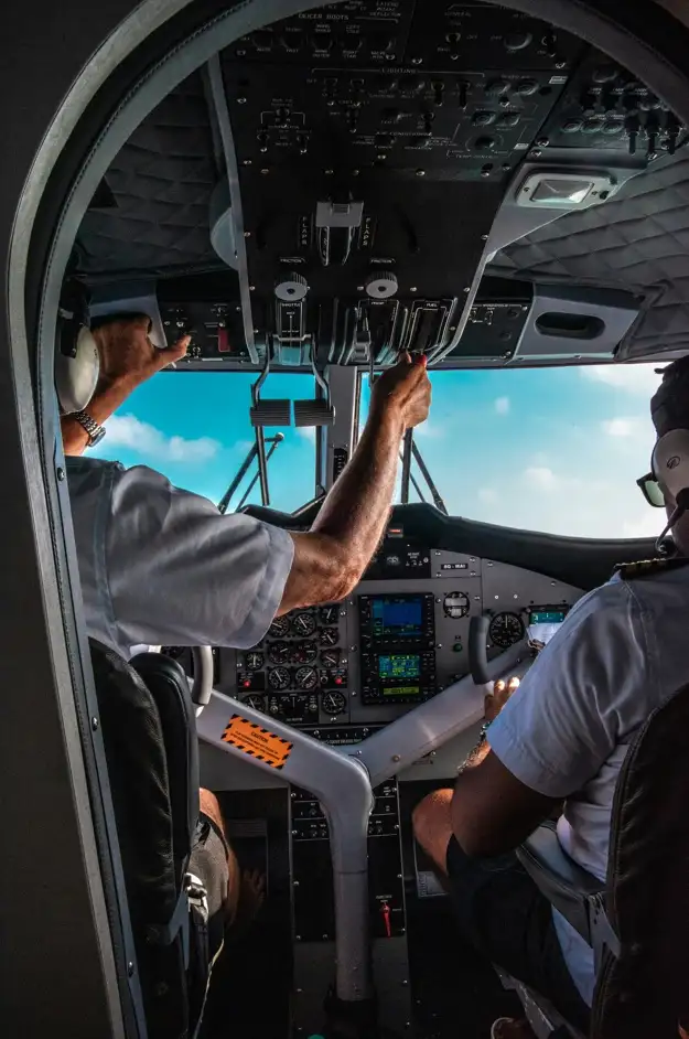 Picture of airline pilots in a cockpit, sourced from unsplash, piture by Rayyu Maldives