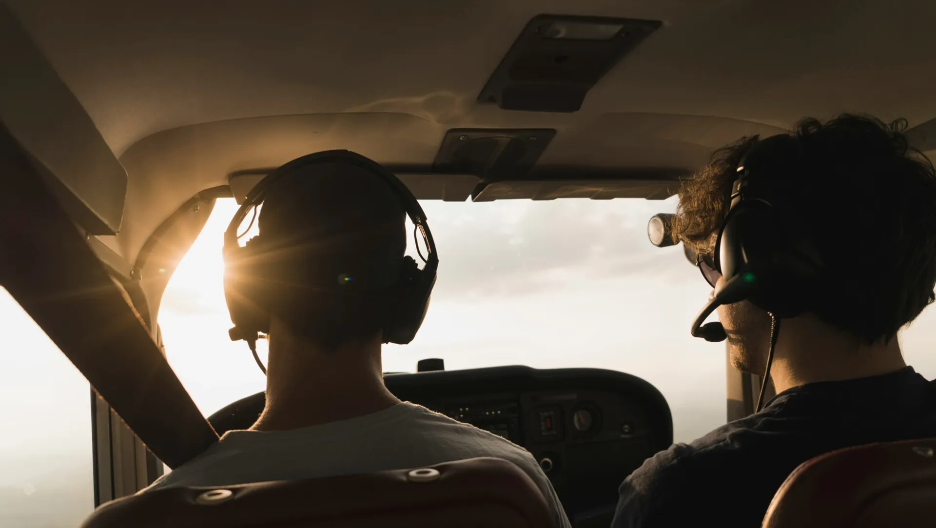 Picture of pilot and co pilot inside plane, sourced from unsplash, piture by Nicolas Jossi