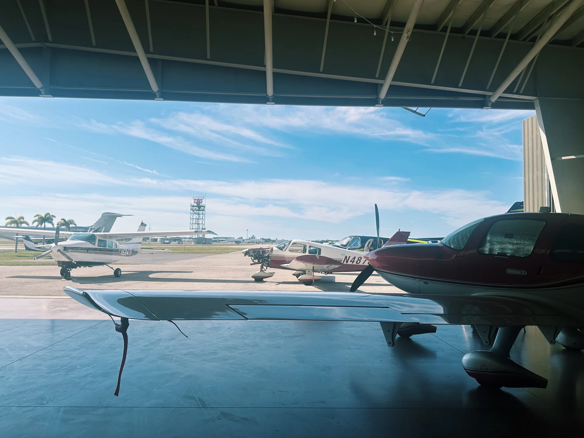 Training aircraft positioned inside a daylight hangar in Sarasota