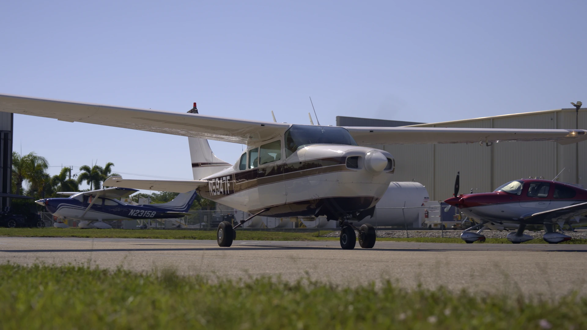 Aircraft taxiing on runway seen from the front