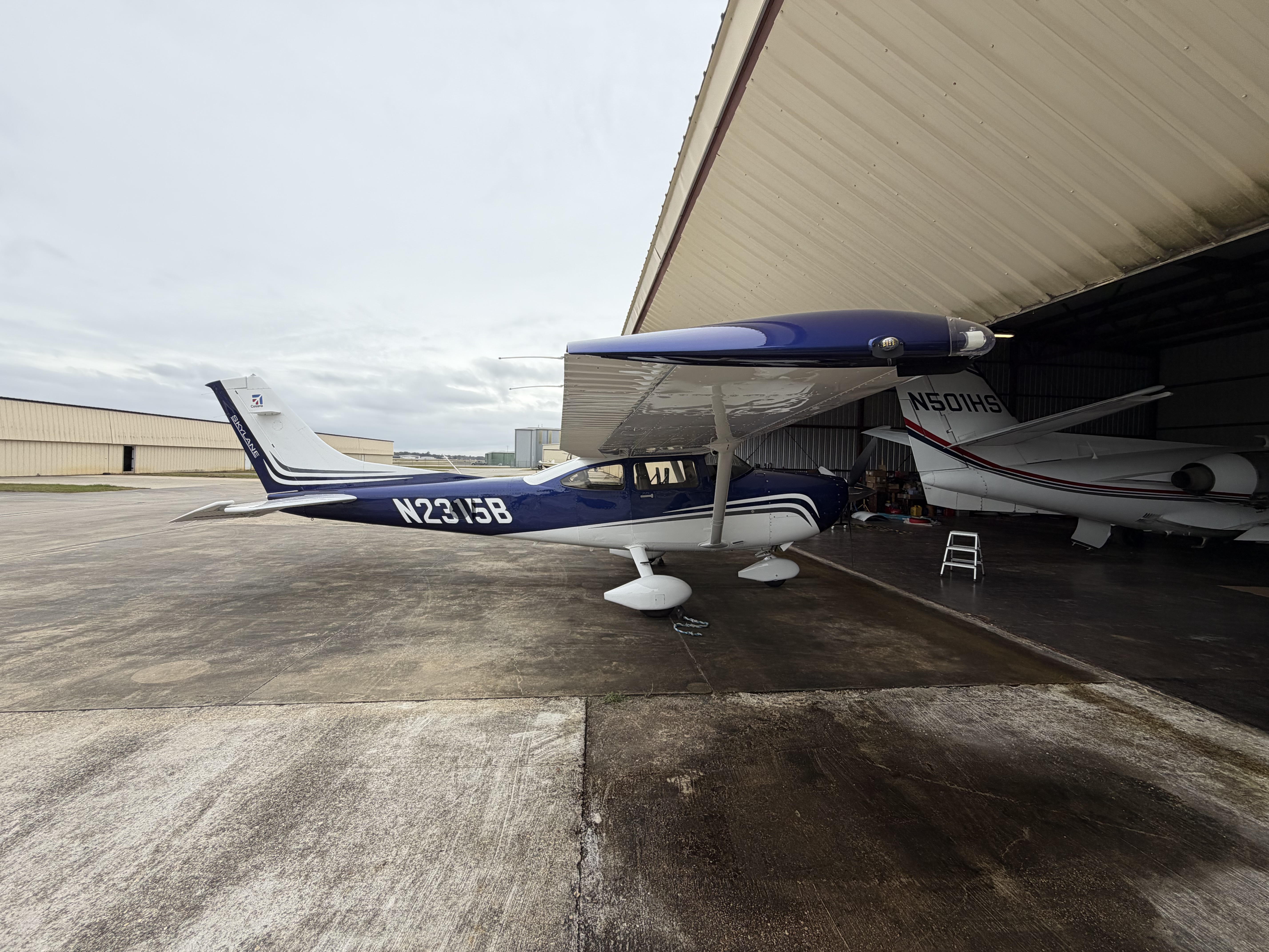 Side view of a Cessna T182 training airplane on the ramp at Universal Flight Training